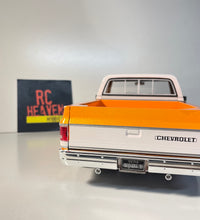 Maisto 1/18 Scale - 1974 Chevrolet C10 Cheyenne Super  - Orange Diecast Model.